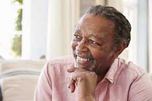 senior man learning about exclusive senior living programs