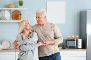 a couple is pleased with exclusive senior living programs